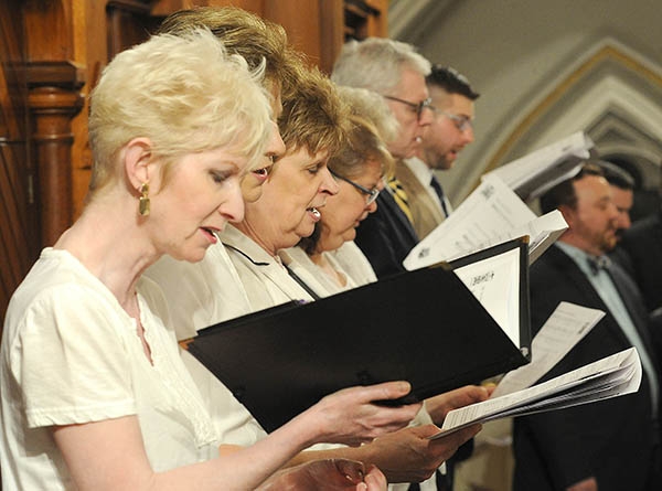 Members of the Diocesan Festival Choir and the St. Joseph Cathedral Choir sing at St. Joseph Cathedral during the annual Chrism Mass. (Dan Cappellazzo/Staff Photographer)